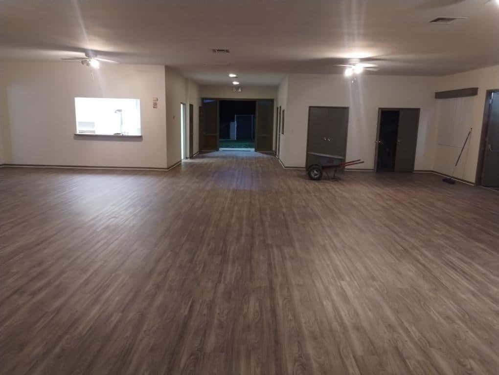 Smooth hardwood flooring installation in a spacious indoor area by Ramos Carpet Installation Inc.