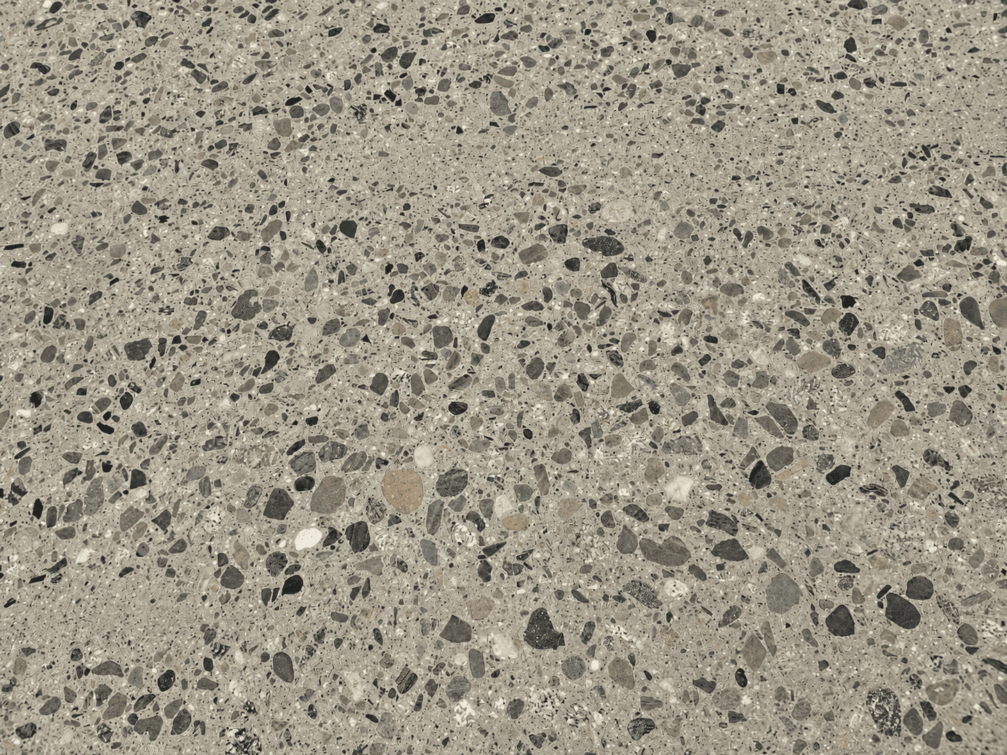 Close-up of polished concrete floor with aggregate finish.
