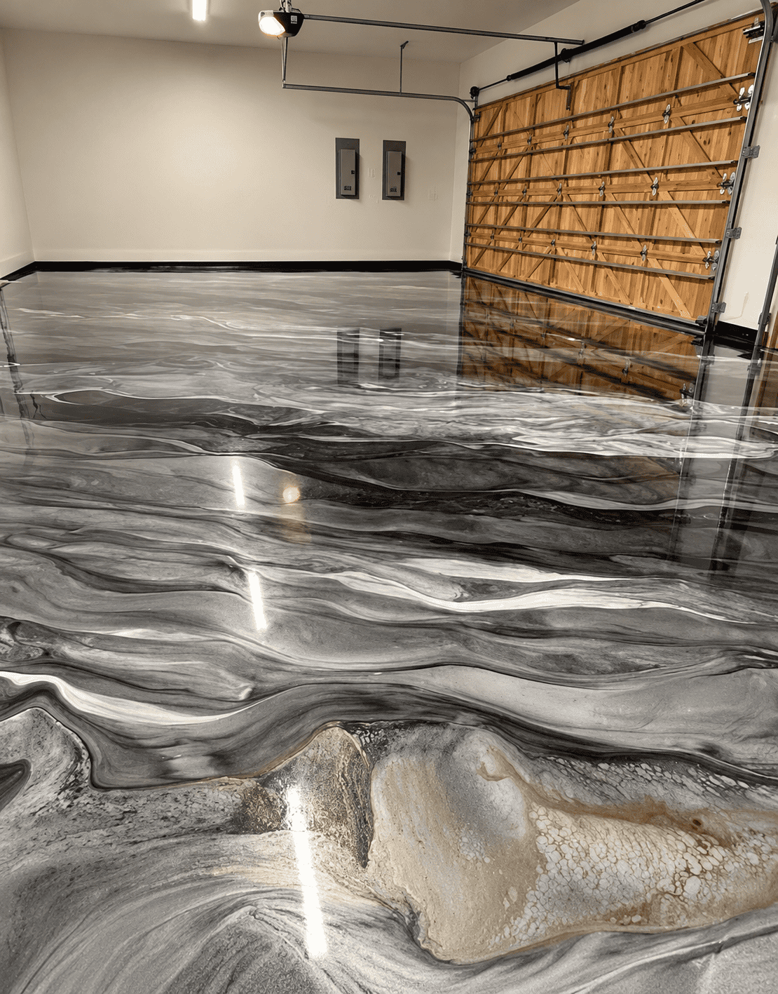 Garage with polished marble flooring and wooden garage door.