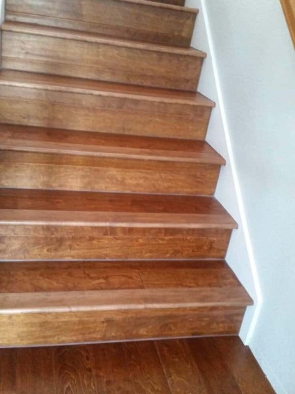 Wood stair renovation with professional flooring installation by Ramos Carpet Installation Inc.